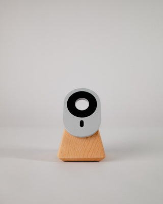 Handmade maple MagSafe stand on white backdrop