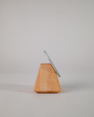 Solid wood iPhone MagSafe charger stand side view showing grain detail