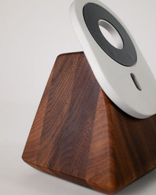 Walnut wood grain detail on handcrafted MagSafe phone stand