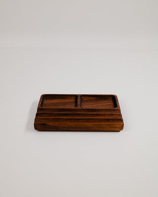Monolith Desk Tray in walnut — solid hardwood catchall tray with two inset compartments, hero product shot