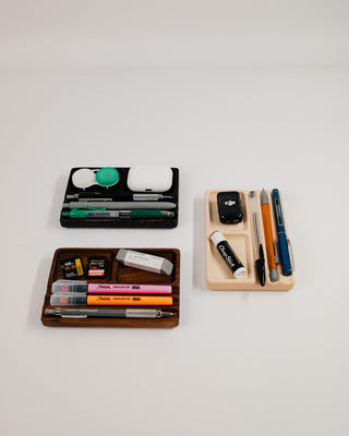 Monolith Desk Tray collection styled with colorful markers, AirPods, and small accessories in all three wood variants