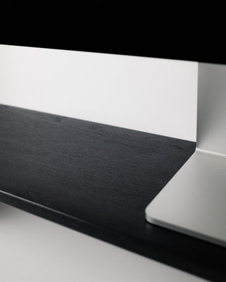 Overhead angle of Monolith Desk Shelf in black oak supporting an Apple Studio Display — wide solid wood monitor riser for desk organization